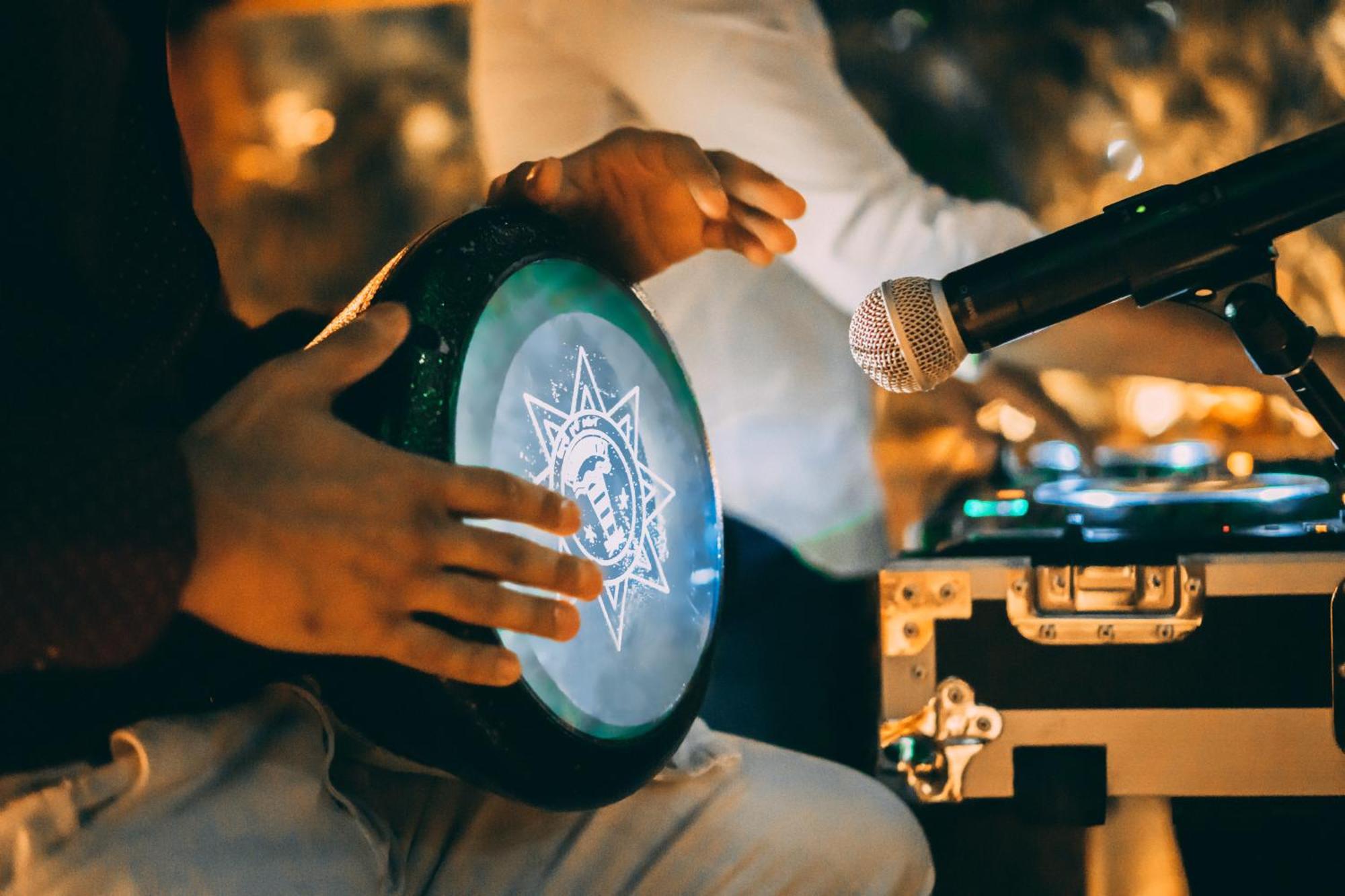 Jumeirah Emirates Towers Дубай Экстерьер фото A musician playing a tambourine